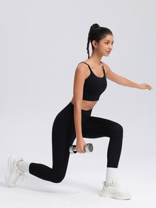 SecondSkin Sculpt Leggings — black leggings shown during a lunge holding a dumbbell