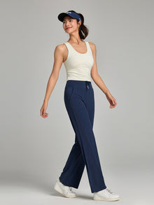 CloudDrape Wide-Leg Active Pants — dark blue pants styled with a light tank and cap